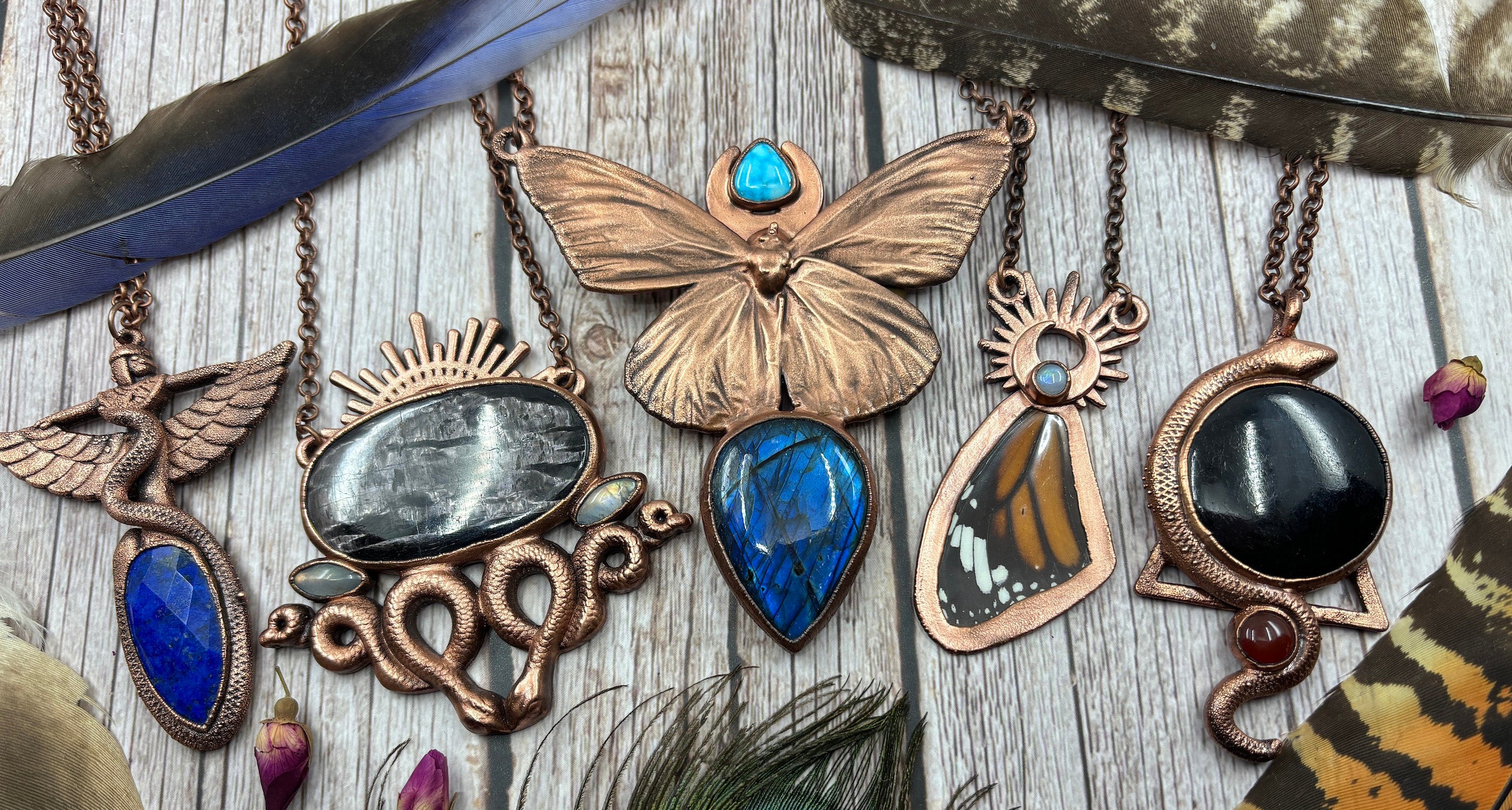 6 copper electroformed crystal necklaces including monarch butterfly, lapis lazuli Egyptian goddess, hypersthene snake and black tourmaline serpent