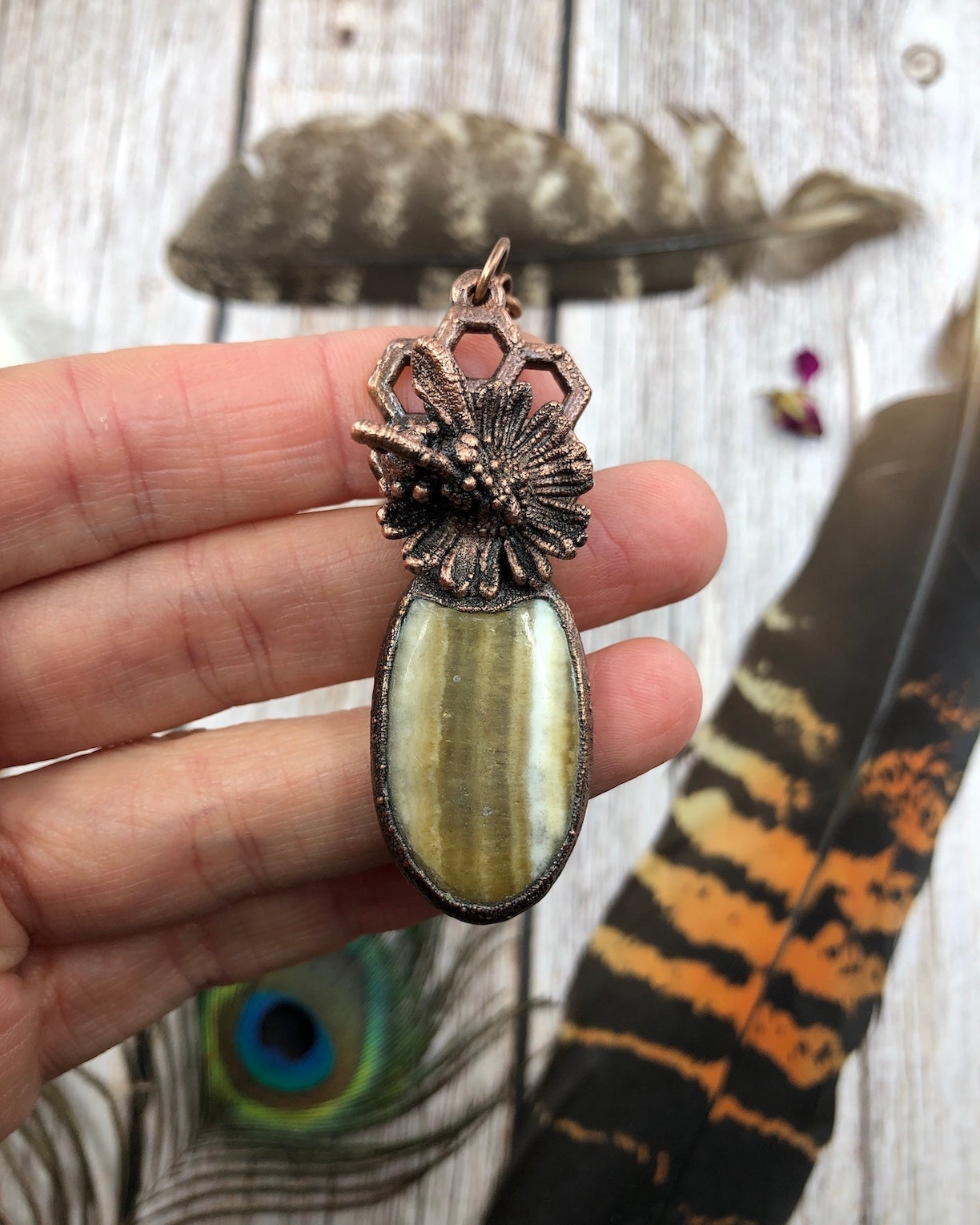 Real bee pendant with Honey Calcite, a real daisy. Copper Electroformed