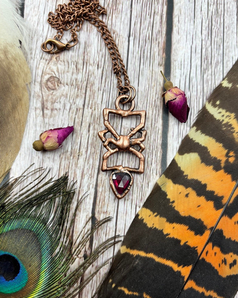 small red back spider copper pendant with garnet, made with a real spider, electroformed