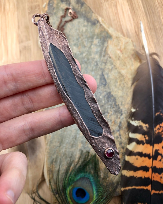 Real feather necklace with a garnet gemstone, made from copper, electroformed