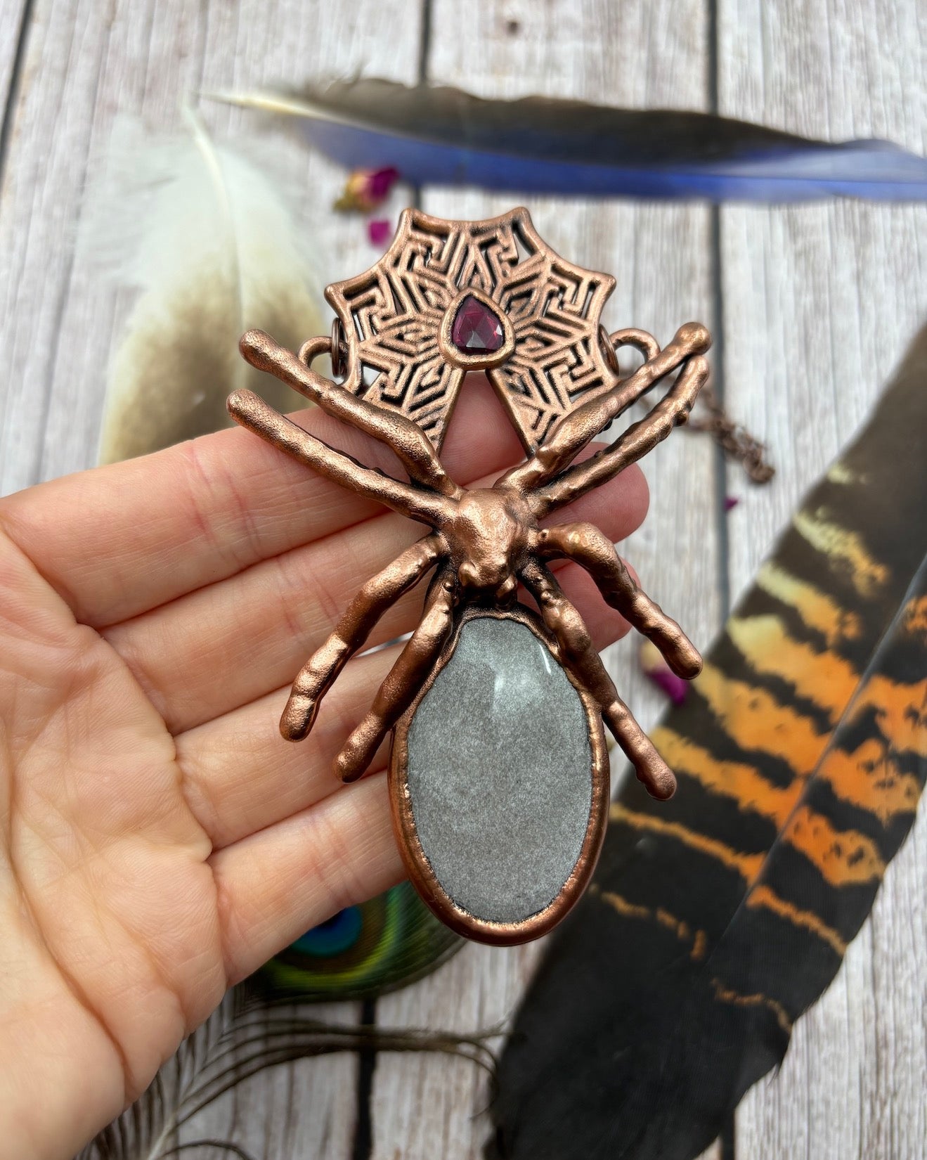 large spider copper pendant with silver sheen obsidian and a small garnet, made with a real large spider, ethically sourced, electroformed