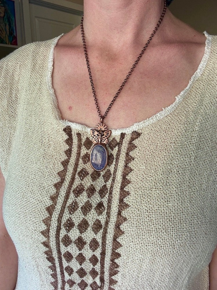 Model wearing Butterfly necklace with Charoite, copper electroformed jewellery