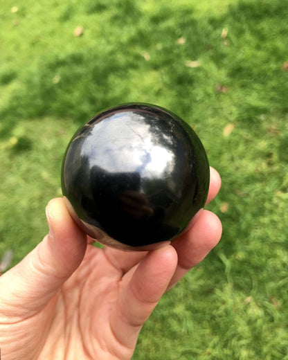 polished shungite sphere from Zazhoginsky mine Karelia Russia