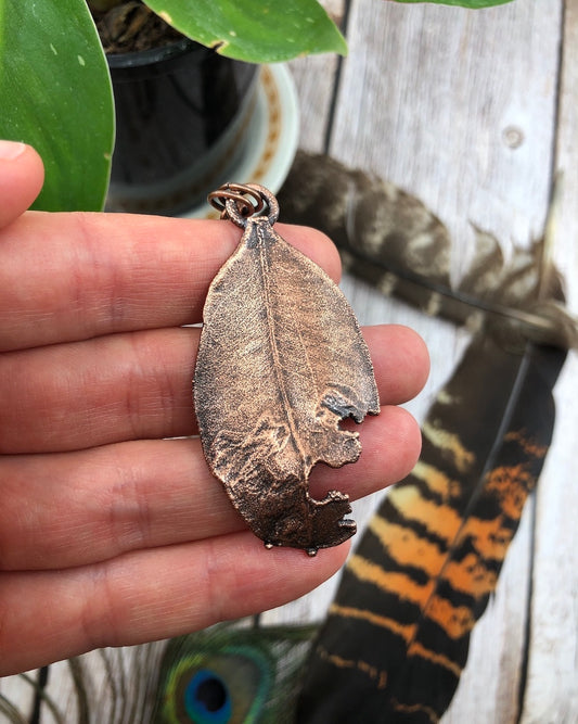 tattered leaf copper electroformed pendant with a real leaf inside