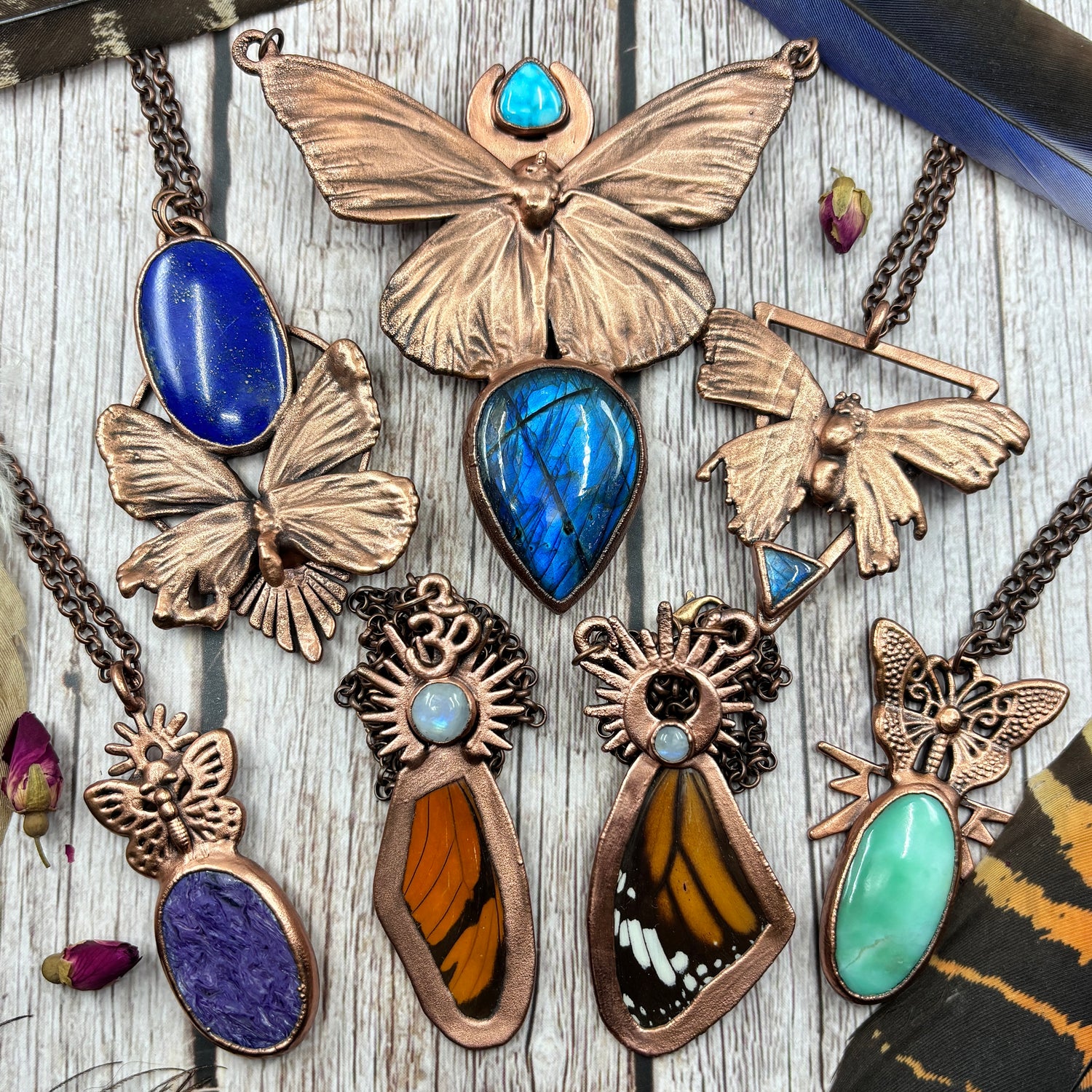 Multiple butterfly wing copper pendants including real butterflies such as monarch & stones such as Chrysoprase, Rainbow Moonstone, Charoite, Lapis Lazuli, Kingman turquoise & blue labradorite 